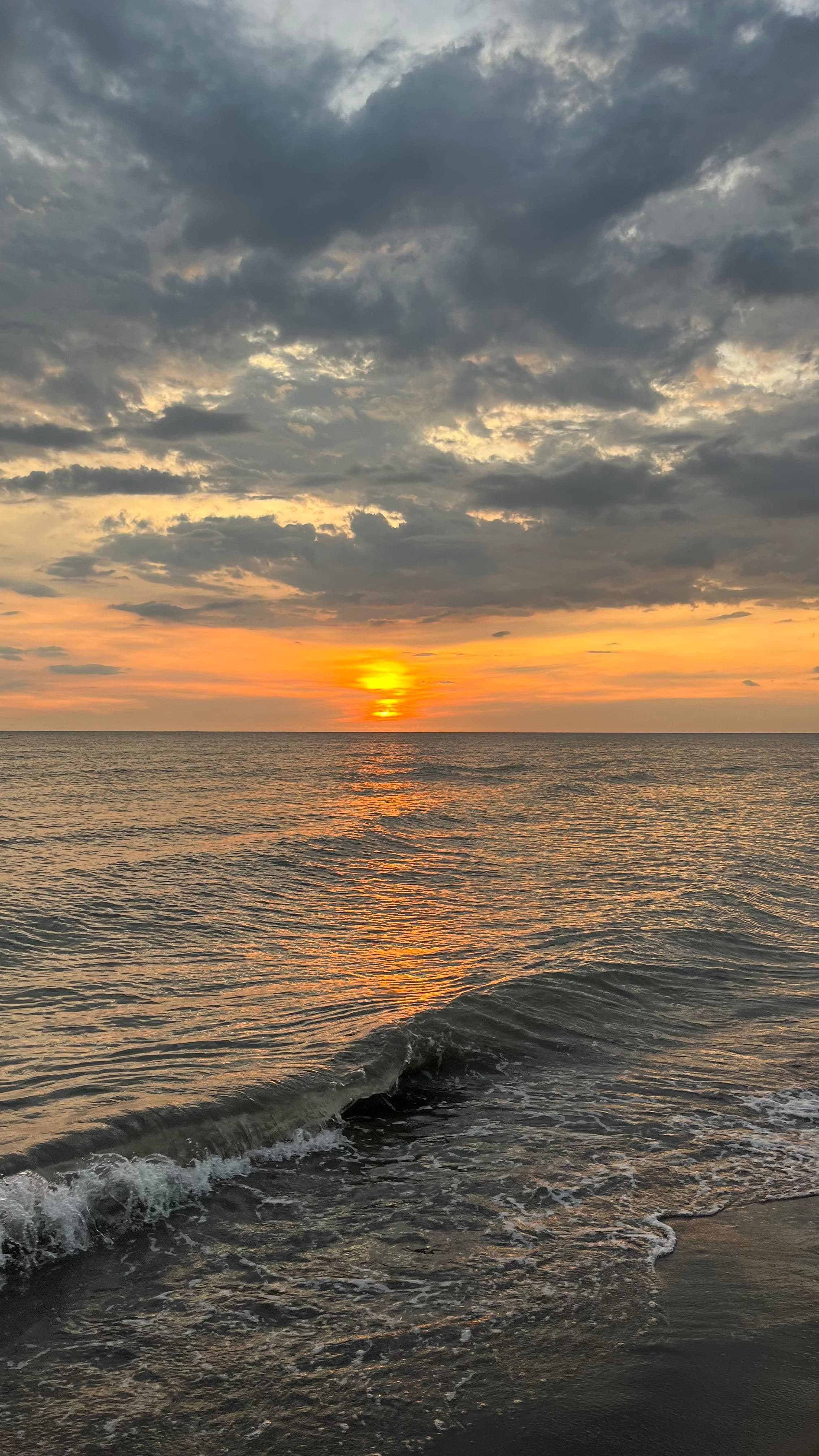 Golden Sunset Over Ocean Waves