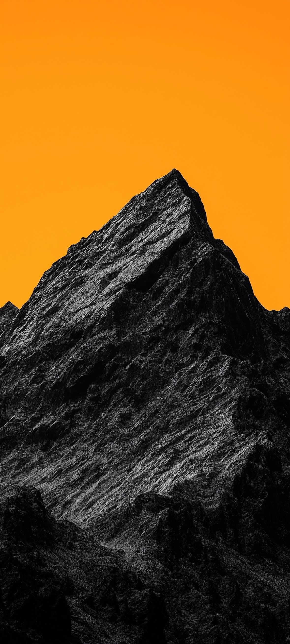 Dramatic Mountain Peak with Golden Sky