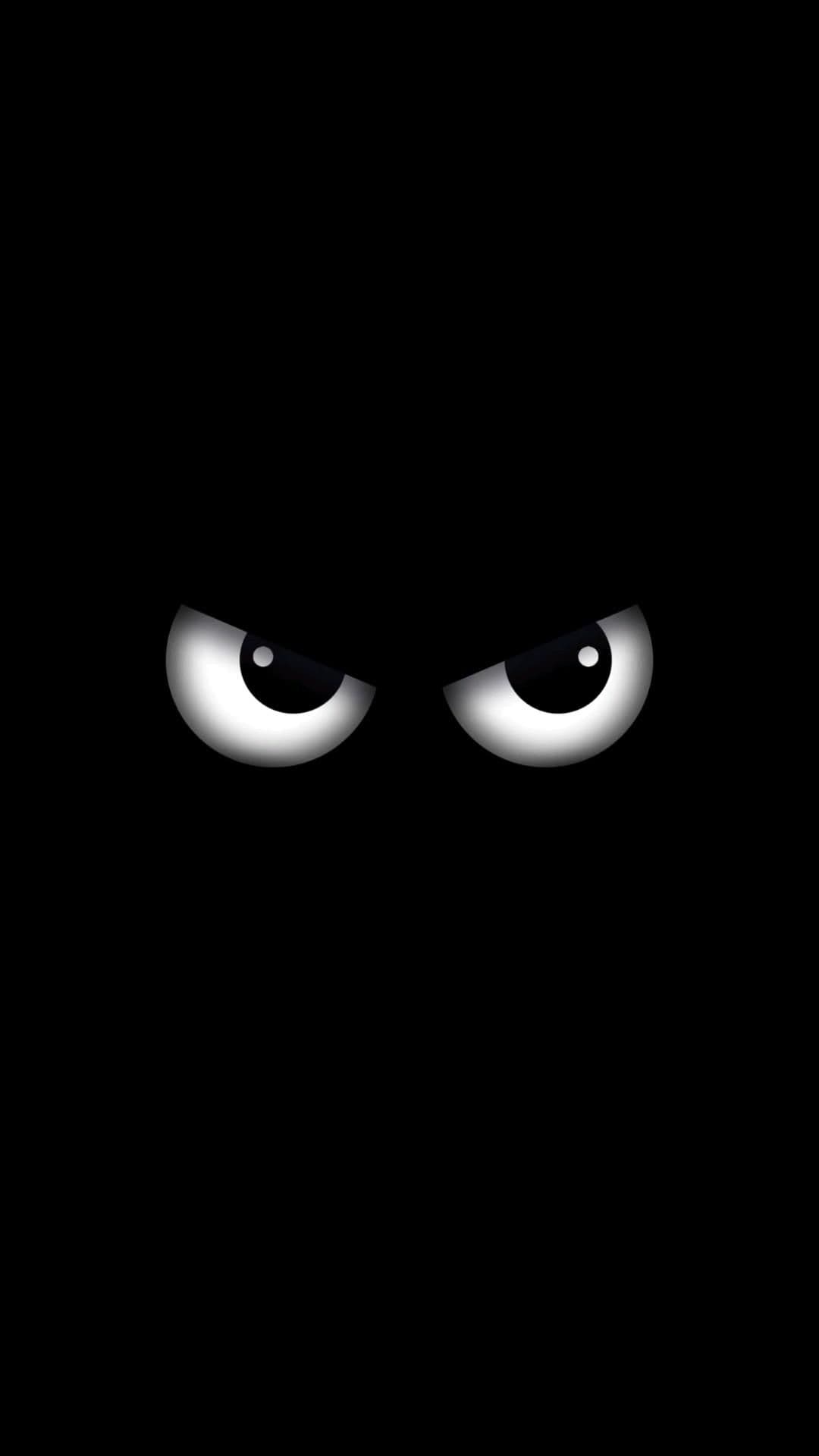 Angry Cartoon Eyes in Dark