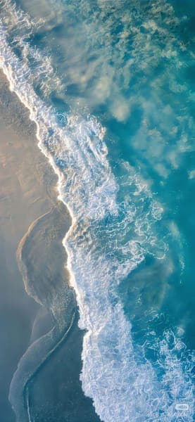 Turquoise Ocean Waves Meeting Sandy Beach Shore