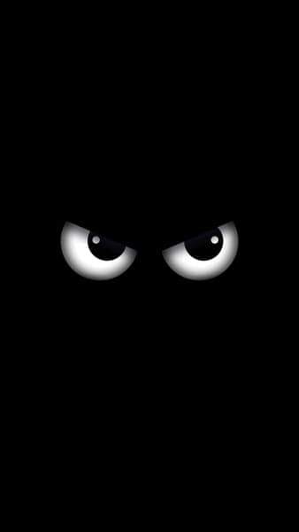 Angry Cartoon Eyes in Dark