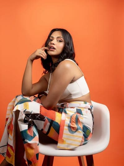 Woman Posing on Orange Background